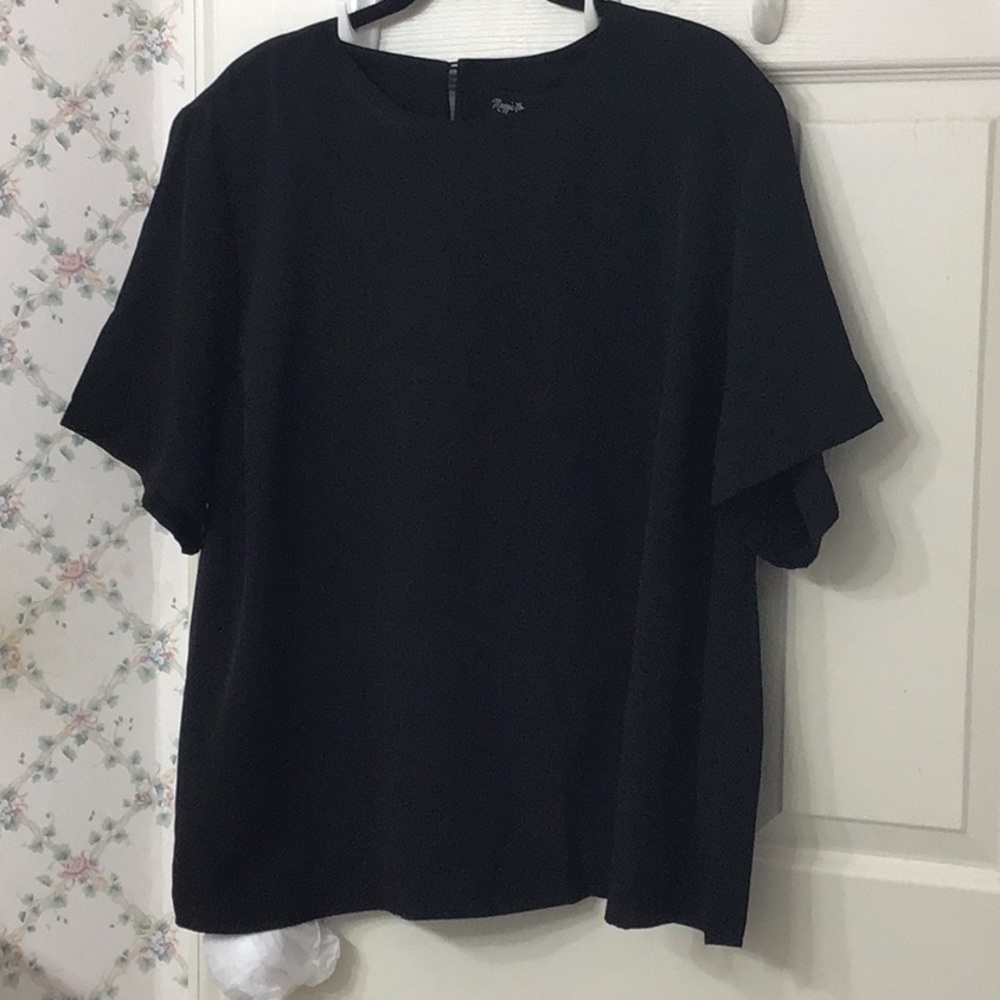 Plus size 2X 100% polyester black blouse. It is 28” in length.